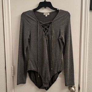 Black and white striped Soulmates body suit.